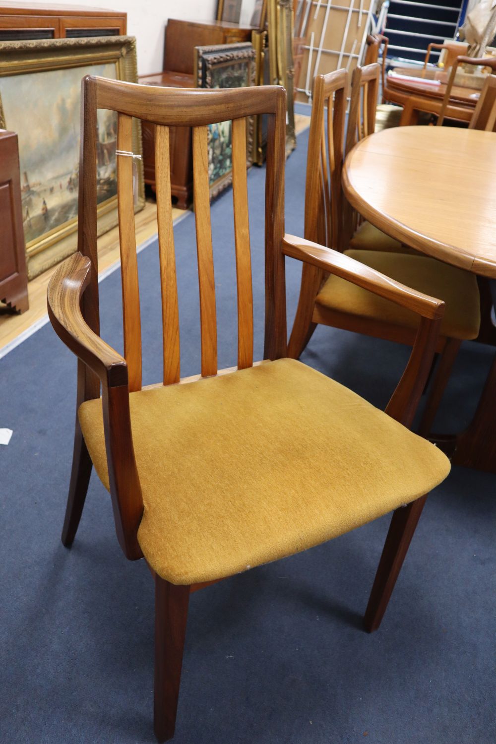 A G plan teak extending dining table, width 102cm, depth 106cm, height 69cm, six chairs and a sideboard